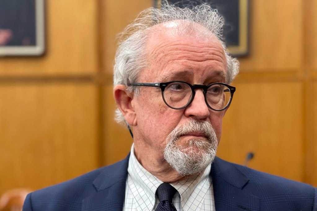 Closeup of Ashby Foote wearing a blue suit and classes