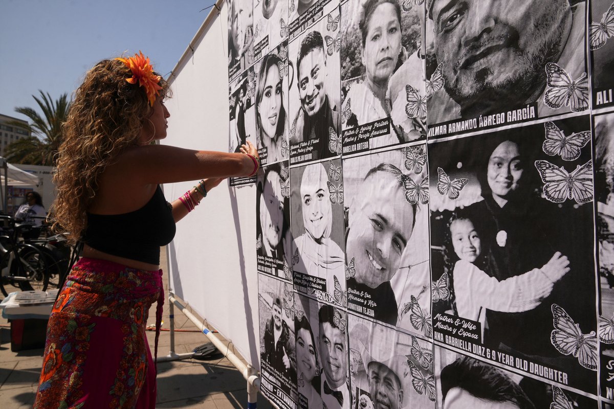 A woman with orange flowers in her hair posts black and white photos of people that have been picked up by ICE