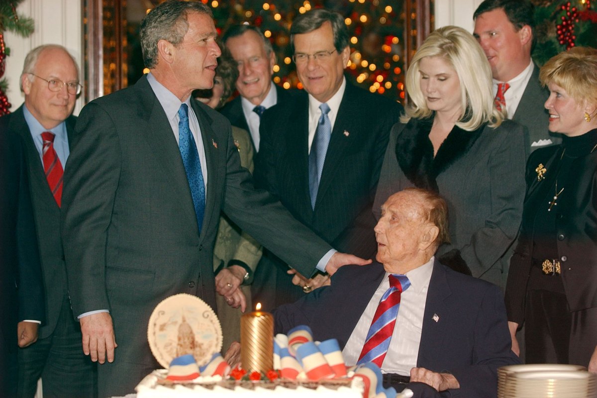 George H.W. Bush congratulates Strom Thurmond, seated, at Throm's birthday party