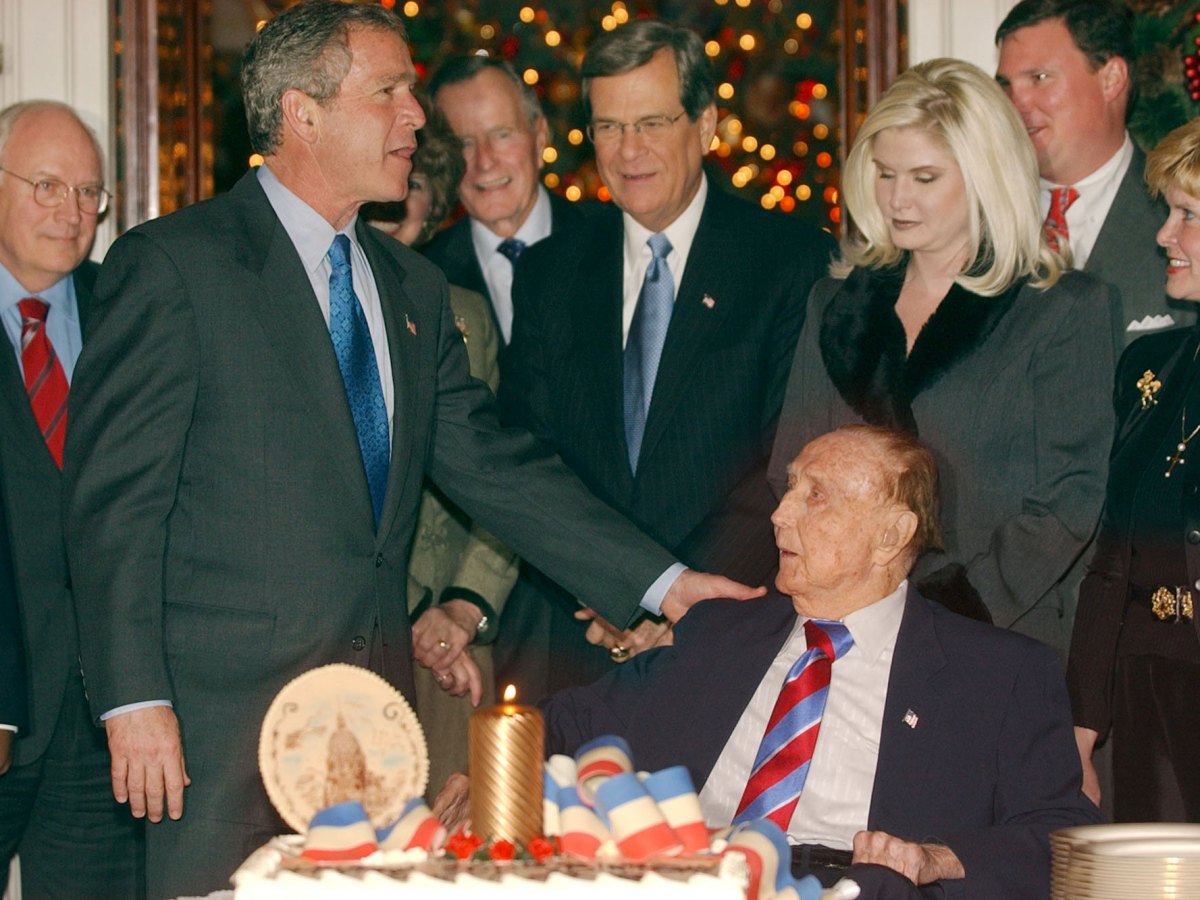 George H.W. Bush congratulates Strom Thurmond, seated, at Throm's birthday party