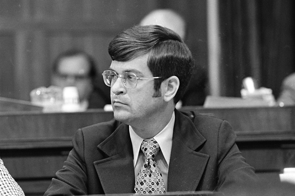 A black and white photo of Trent Lott in a committee room