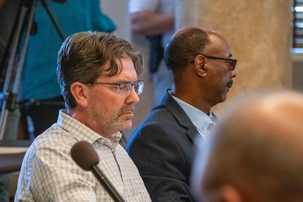 Dan Eubanks seated beside Gregory Holloway