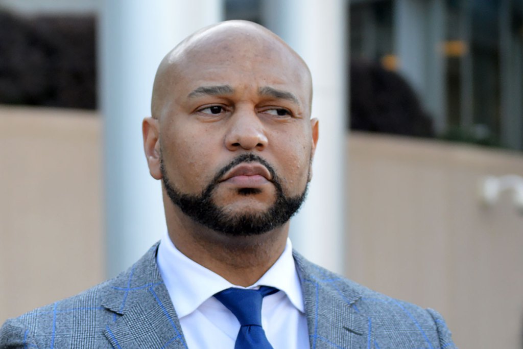 Headshot of Carlos Moore looking to the right
