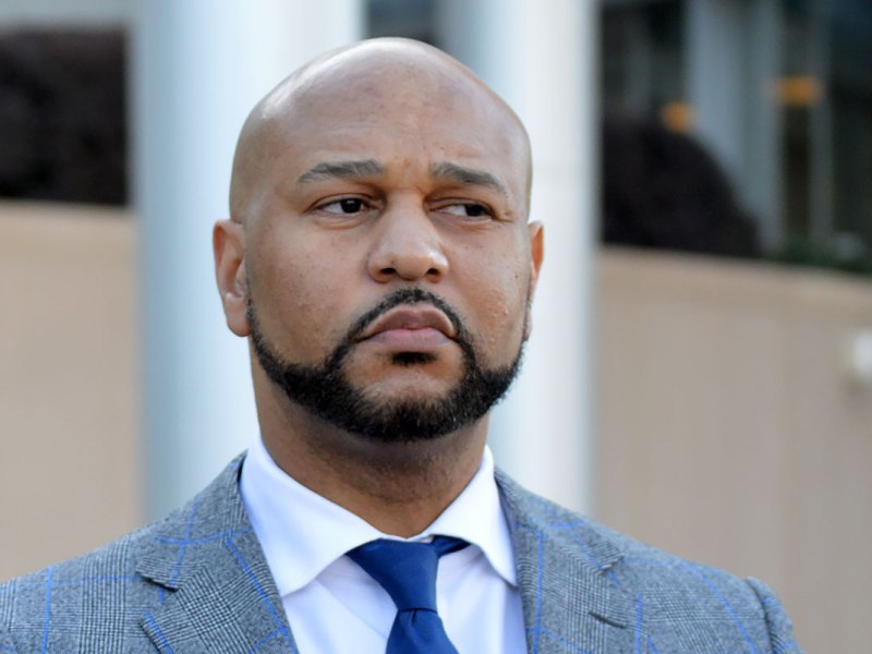 Headshot of Carlos Moore looking to the right