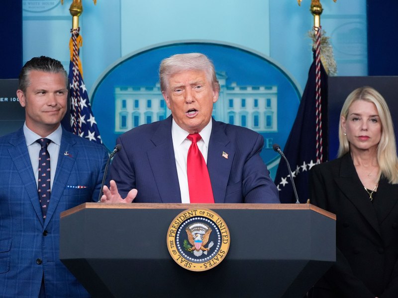 Donald Trump speaks at n official White House presser as Pete Hegseth and Pam Bondi look on
