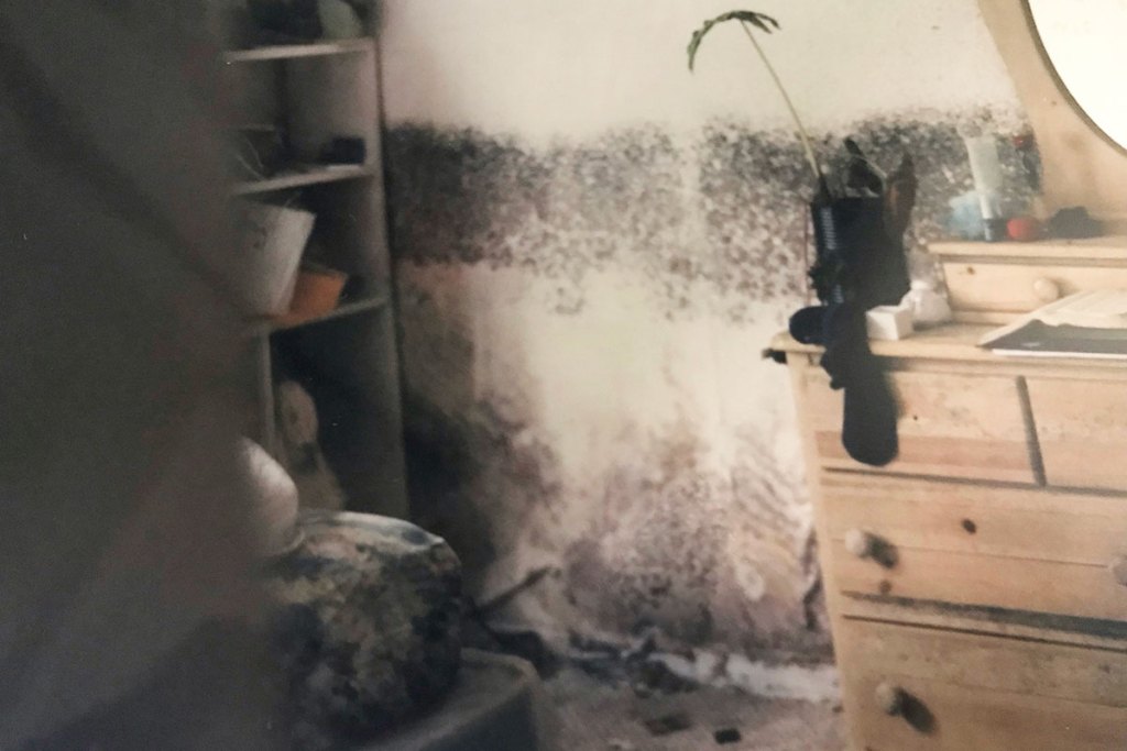 Flood damage seen in a bedroom