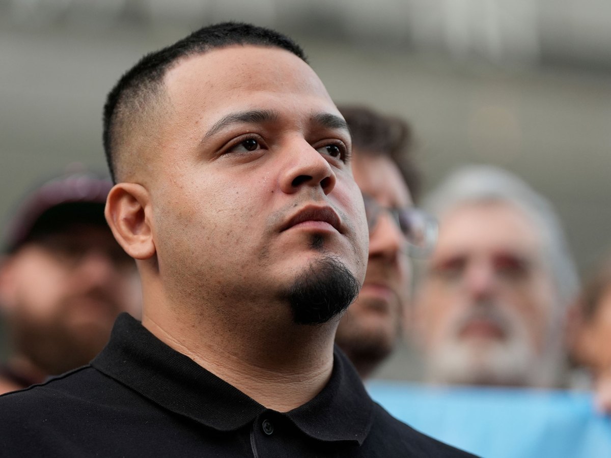Closeup of Kilmar Abrego Garcia looking up in a crowd