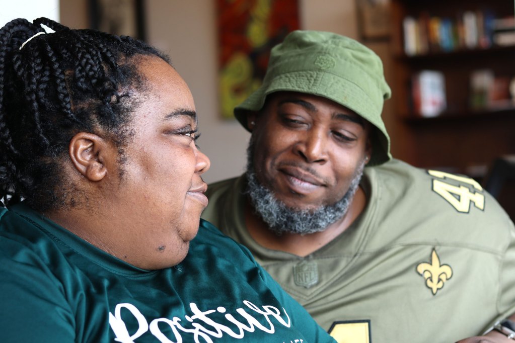 A man and a woman exchange sweet glances