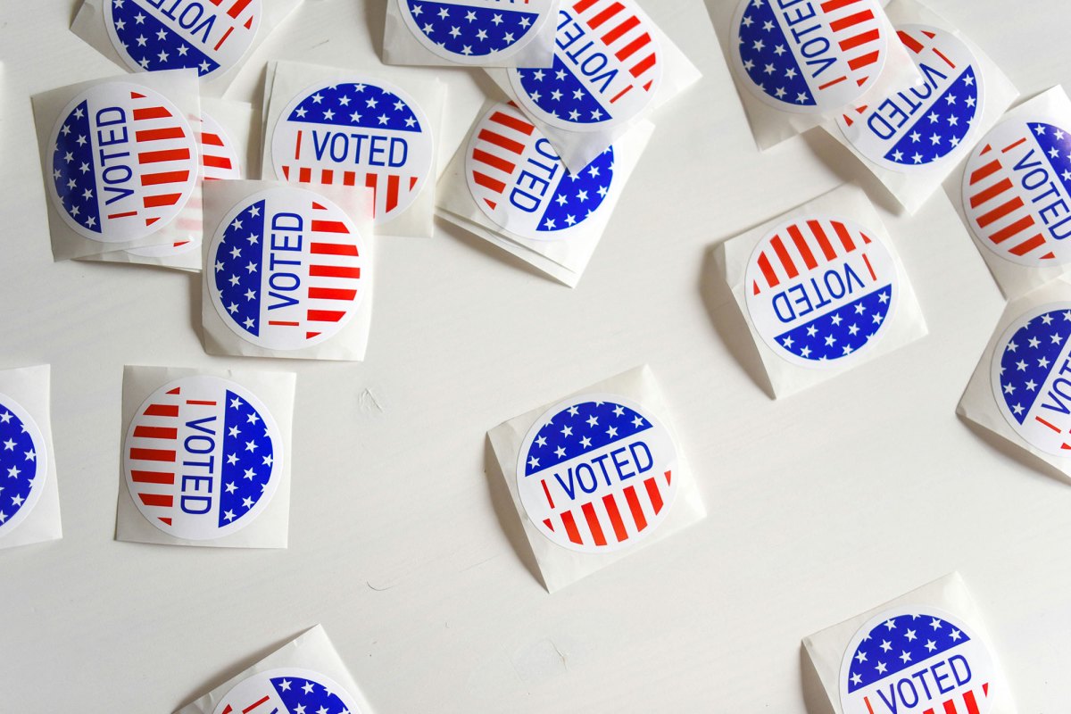 Scattered piles of stickers that say I Voted