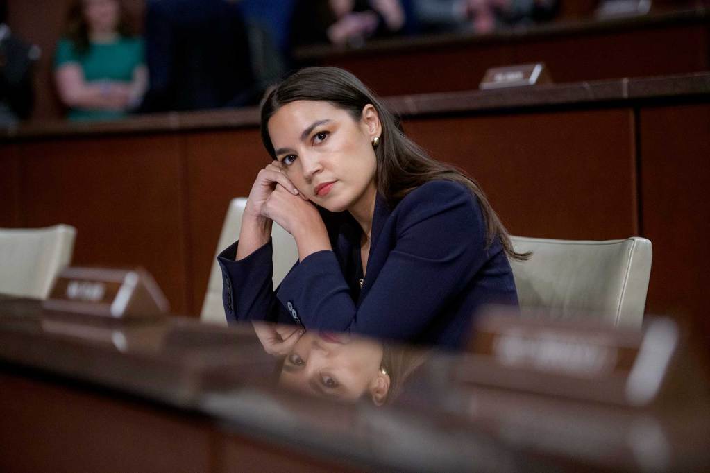 Alexandria Ocasio-Cortez listening in the senate