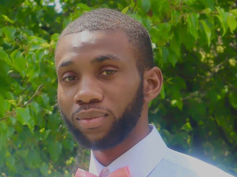 Demartravion Reed standing outside by greenery