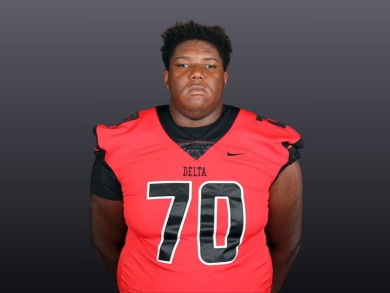 Emanuell Cook wearing a red Delta number 70 jersey for his football profile photo