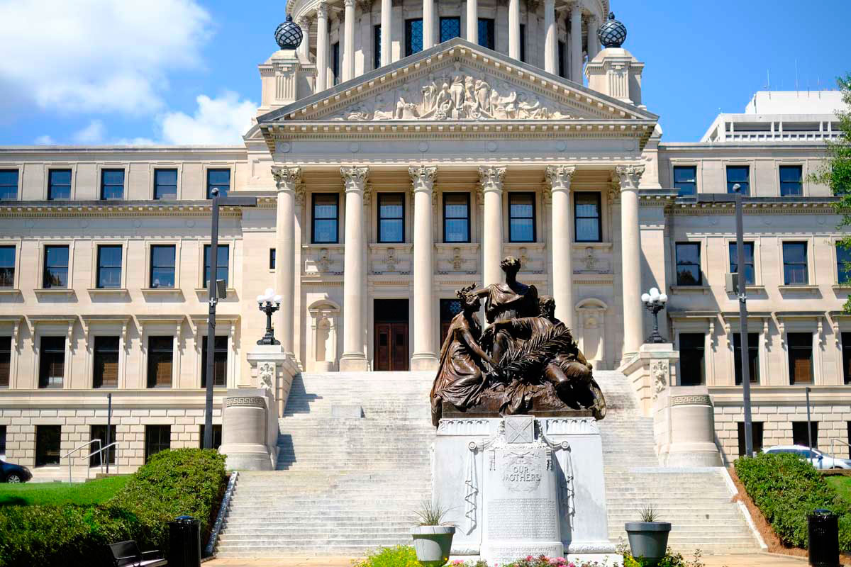 A statue in front of the Mississippi Capitol building.
