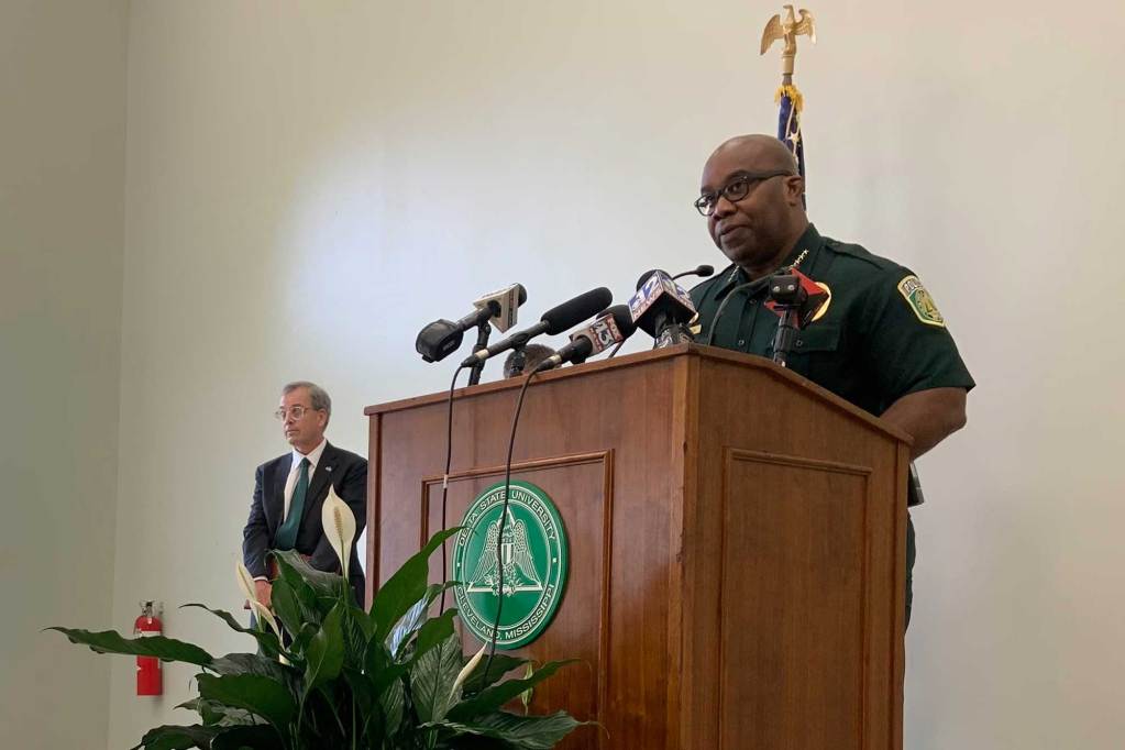 A police chief speaks at a podium