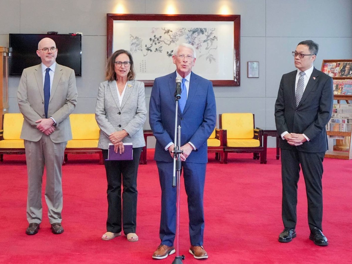 roger wicker and deb fischer stand center at a microphone while two men stand on either side of them