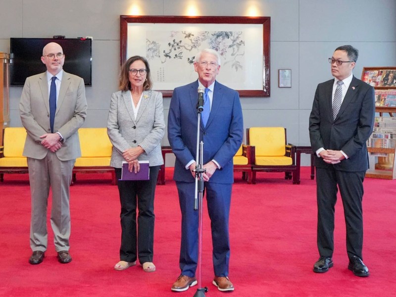 roger wicker and deb fischer stand center at a microphone while two men stand on either side of them
