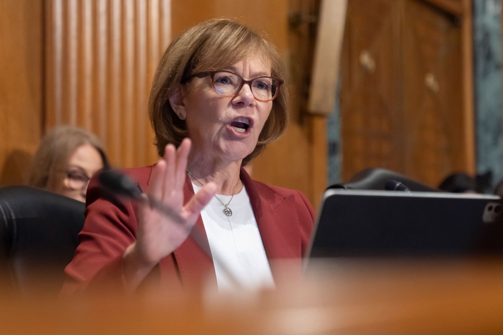 Tina Smith speaks at a committee hearing