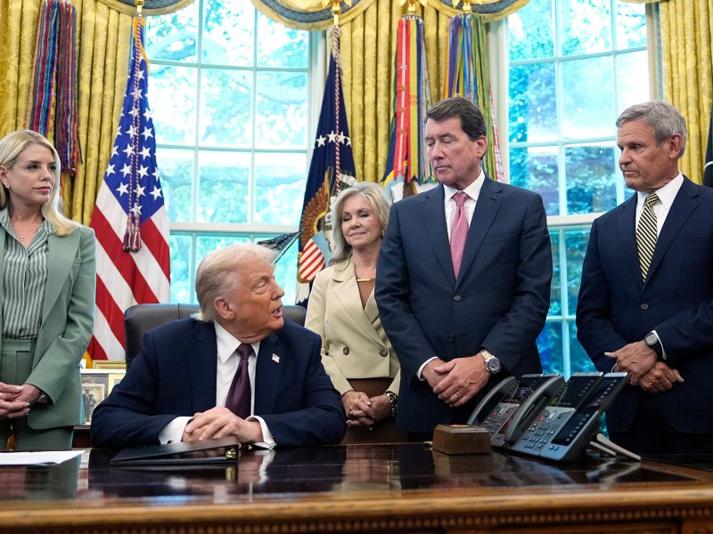 Donald Trump speaks as others listen in the Oval Office