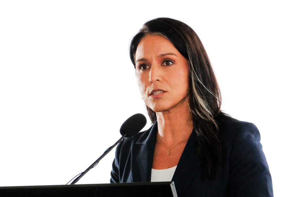 Tulsi Gabbard speaking on a podium