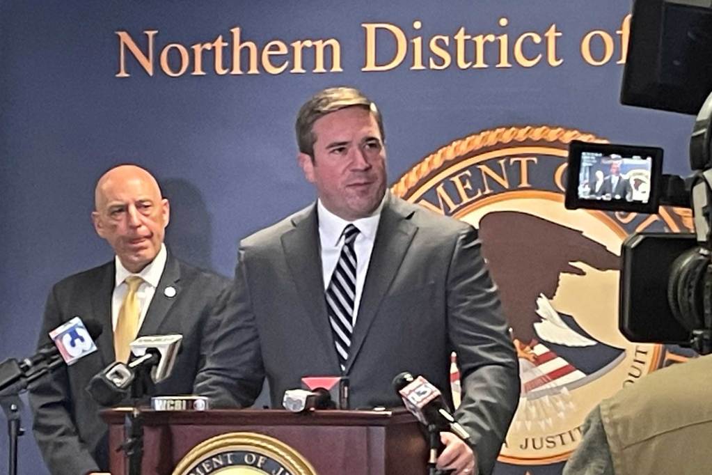 Two FBI agents give a department of justice press conference