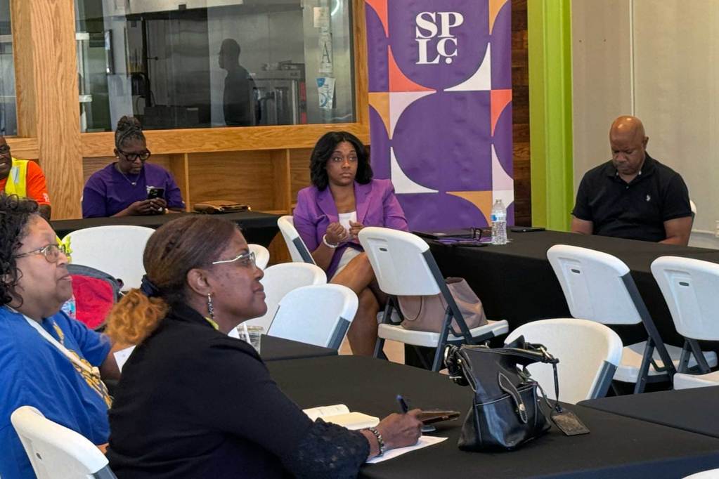 People sit around tables at a Southern Poverty Law Center conference