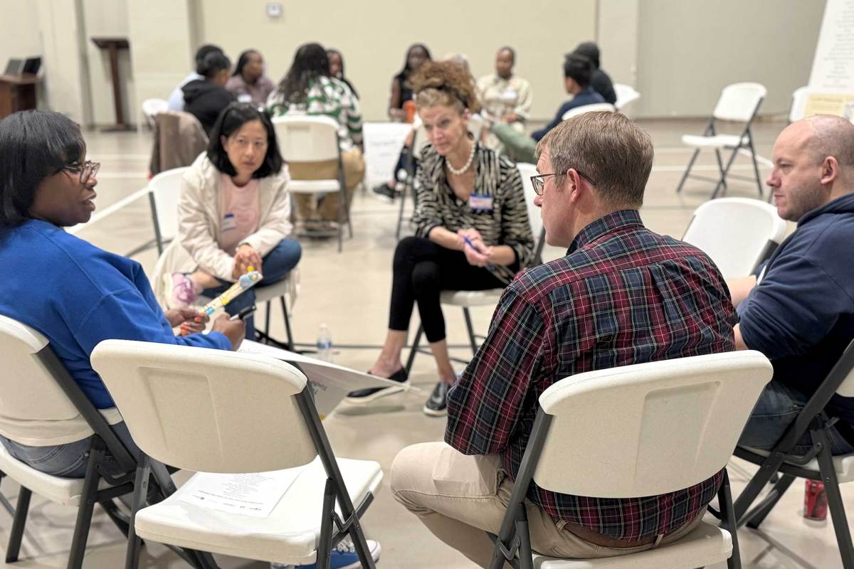 A circle of seated people talking
