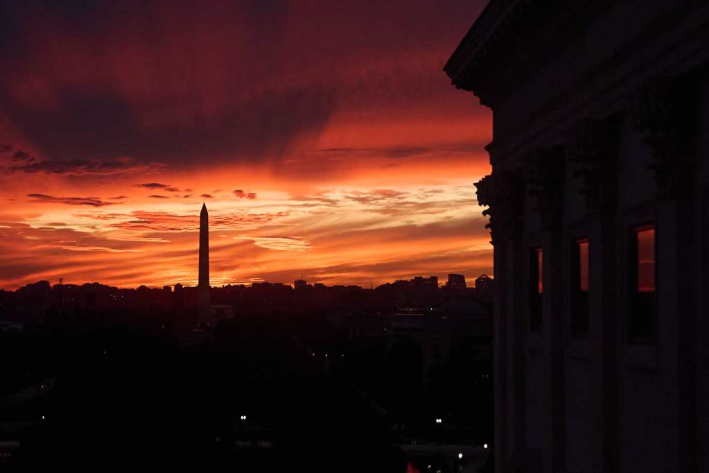 A silhouette of Capitol Hill is seen at sunset
