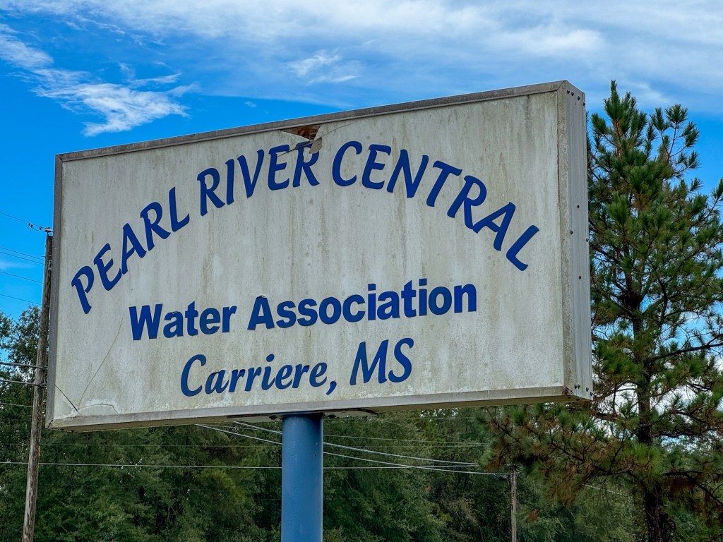 A sign that reads, “Pearl River Central Water Association, Carriere MS”