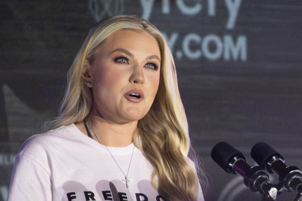 Erika Kirk speaks at a microphone
