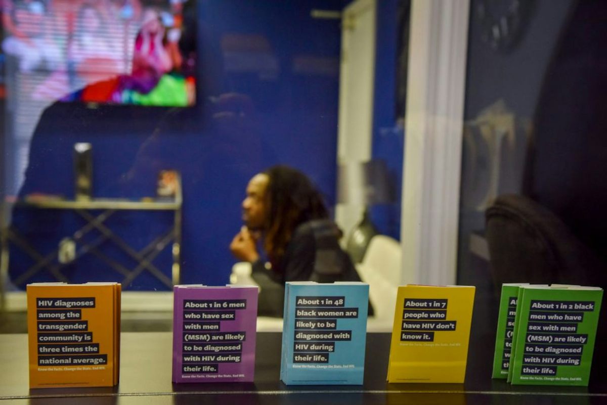 Five pamphlets colored orange, purple, blue, yellow and green.