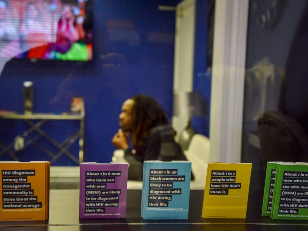 Five pamphlets colored orange, purple, blue, yellow and green.