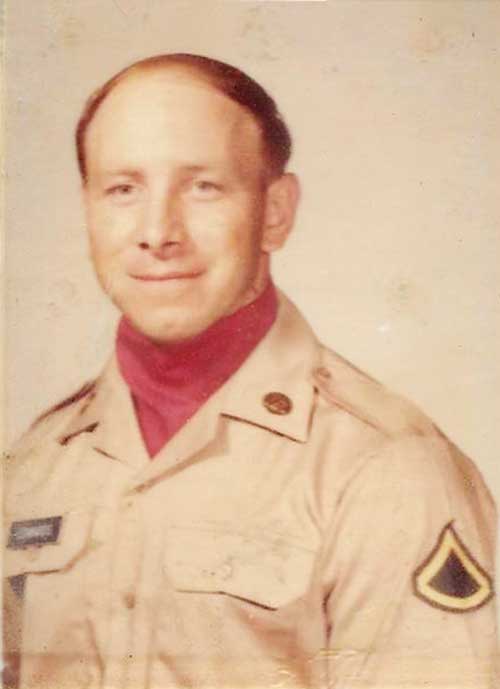 A man in a beige U.S. Army uniform in an old photo