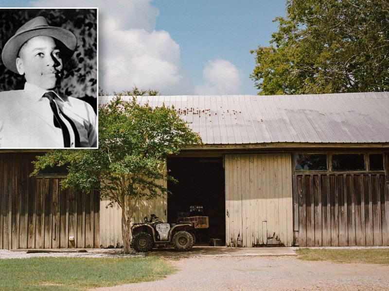 Emmett Till's photo is inset over a photo of an old barn with a door open. An old tractor is parked in front underneath the shade of a young tree