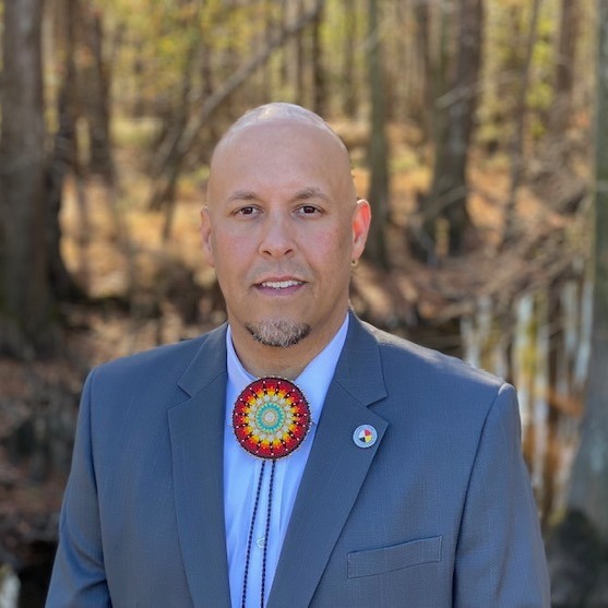 John L. Lowery in suit and native beadwork bolero tie