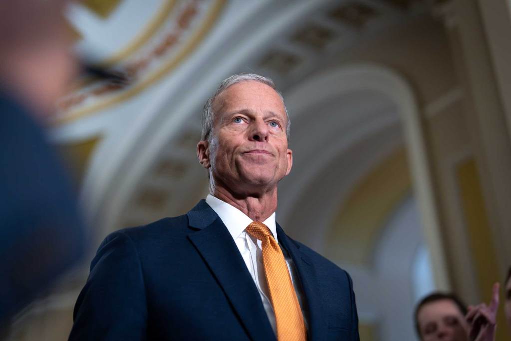 A photo of Senate Majority Leader John Thune speaking with reporters.