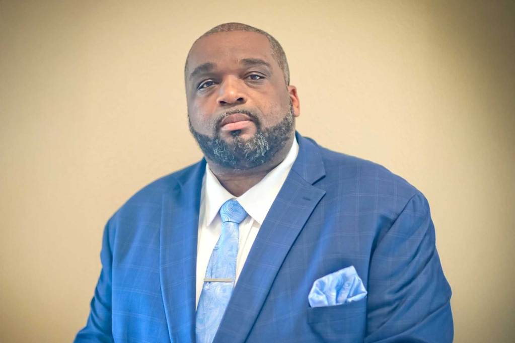 Justin Crosby in a blue suit