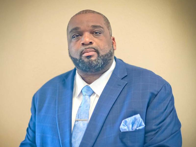 Justin Crosby in a blue suit