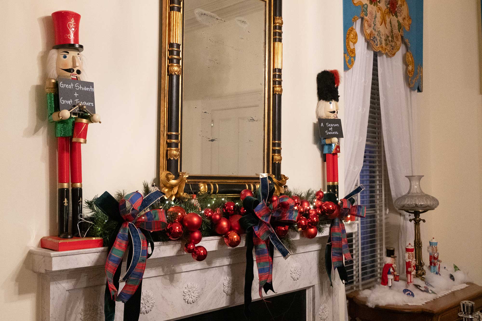 A fireplace in the Governor's Mansion is covered in Christmas garland and nutcrackers