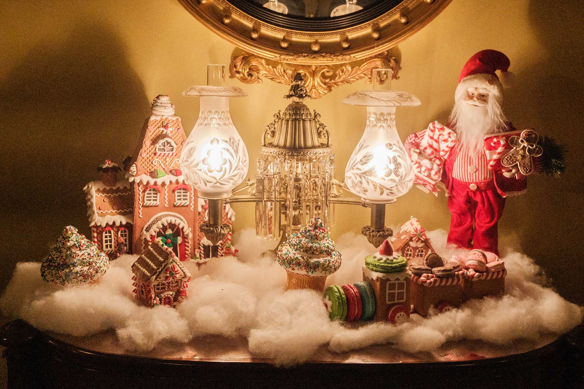 A Christmas scene is set up on a side table