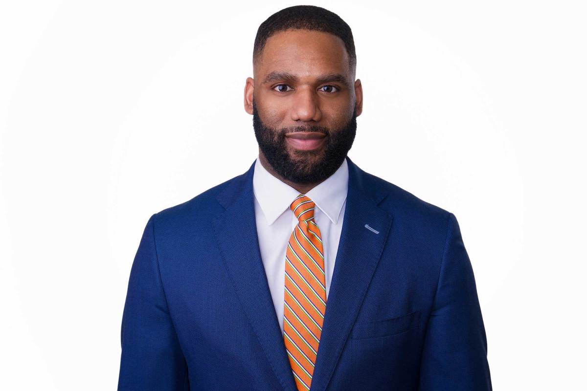 An official headshot of Evan Turnage on a white background