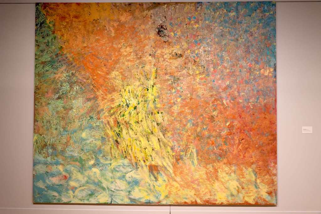 A square piece of artwork painted in colored beeswax in an impressionist style