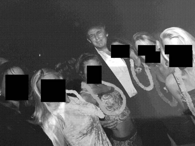 A grainy black and white image showing Donald Trump surrounded by women or girls in beachwear