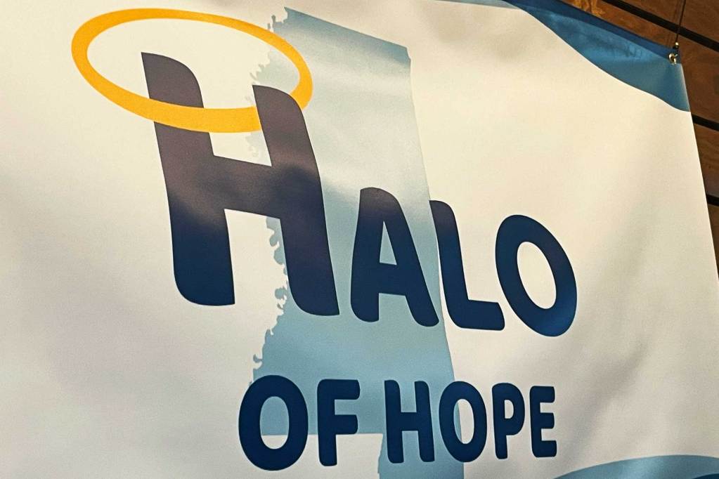 A white and blue sign that reads 'Halo of Hope'