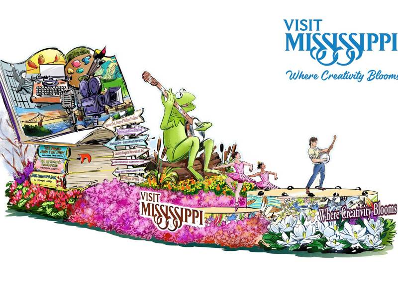 An illustration of a flower-covered float featuring Kermit the Frog, labeled 'Visit Mississippi' and "Where Creativity Blooms'
