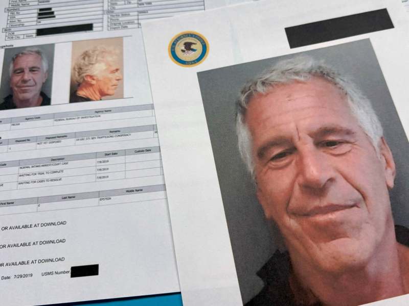 Two printed pages of Jeffrey Epstein's mugshots from the Epstein files