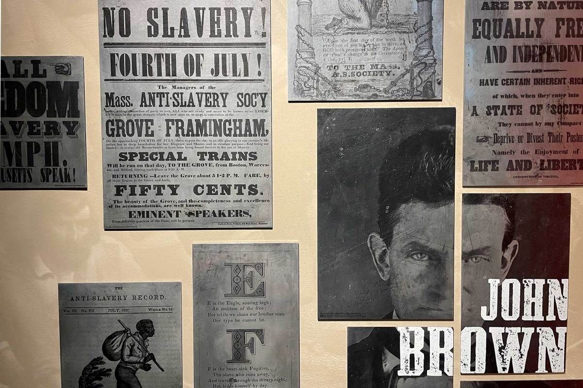 A collage display in a museum featuring John Brown and bills that read "No Slavery! Fourth of July!"