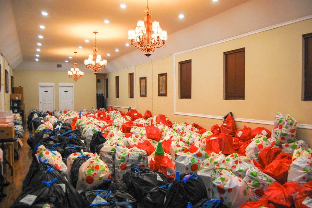 A room completely filled with bags wrapped for the holidays