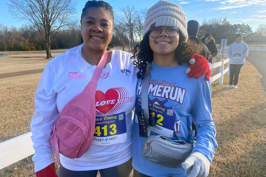 Two people posted together from a race