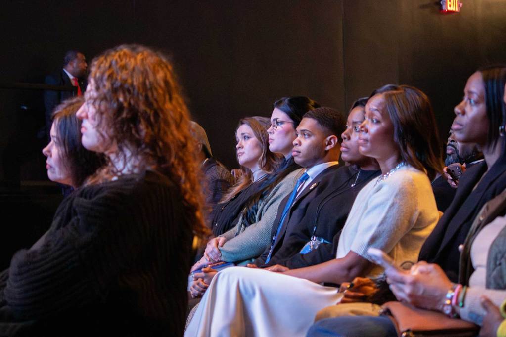 A view of a diverse audience seated for an event