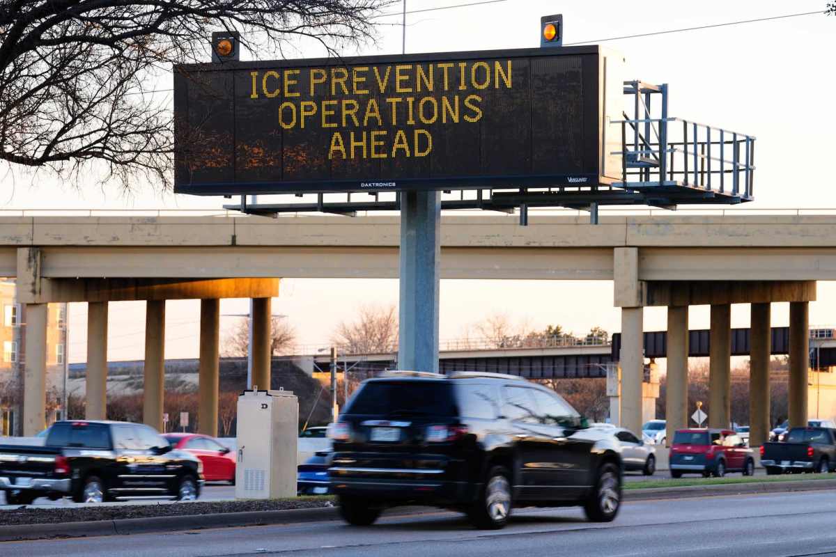 An electronic billboard on a highway that says, “Ice Prevention Operations Ahead.”